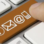 Finger pressing keyboard key with contact icons
